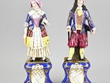 paire de figurines en porcelaine représentant un homme et une femme