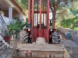 a forklift that is sitting in the dirt