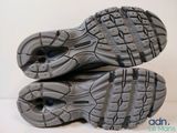 the soles of a pair of running shoes on a white surface