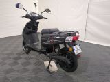 a scooter that is parked in a room