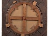 a wooden frame with a circular design on it