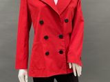 a mannequin wearing a red jacket and black pants