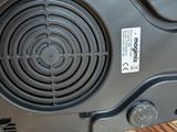 a close up of a black speaker on a table