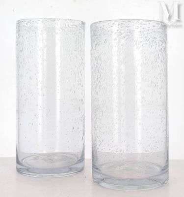 two glasses that are sitting on a table