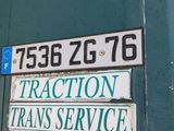 a sign on the side of a building that says traction trans service