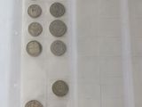 a lot of coins in a plastic bag on the table