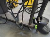 a machine that is sitting on a cart in a warehouse