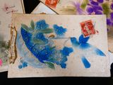 a picture of a blue bird with flowers on it