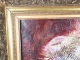 a picture of a painting of flowers in a gold frame