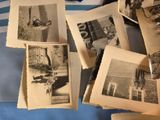 a pile of old photos that are on a table