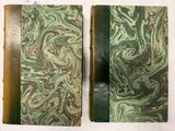 une image représentant deux livres ornés de motifs verts et rouges