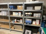 many shelves with various items on them in a room