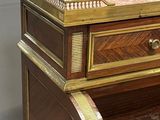 a wooden desk with a drawer on top of it
