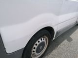 a white van that is parked in a parking lot