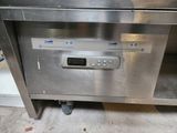 a digital clock on the front of a stainless steel dishwasher