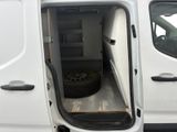 a white van with a flat tire inside of it