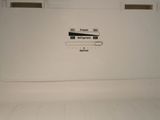 a white refrigerator with a door open in a room