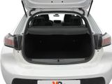 the back end of a white car with its trunk open