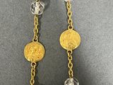 a close up of a pair of earrings on a table