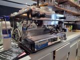 a coffee machine on a counter in a coffee shop