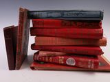 books stacked on top of each other on a white surface