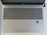 an open laptop computer sitting on top of a white table
