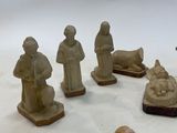 a lot of figurines that are sitting on a table