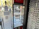 many glasses on display in the window of a store