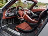 the interior of a sports car with a leather seat and dashboard