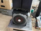 a record player sitting on top of a stereo system
