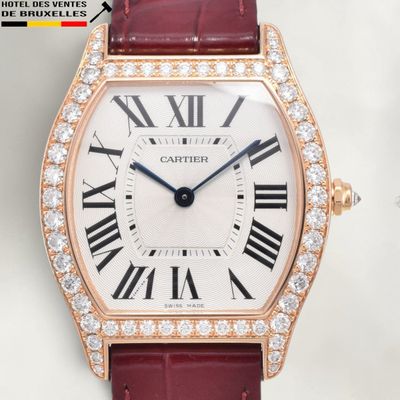 an image of a close up of a wrist watch with roman numerals