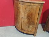 a small wooden cabinet with two doors and a drawer