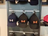 many hats and hats on display in a store