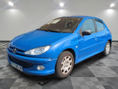 a picture of a blue car parked in a garage