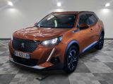 the orange car is parked in the garage on a checkered floor
