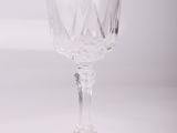 a wine glass that is sitting on a table