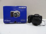 an image of a camera sitting on top of a table next to a box
