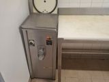 a small room with a small bed and a small sink