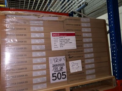 a large stack of boxes sitting on a pallet in a warehouse