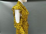 the mannequin is wearing a yellow and black leopard print dress