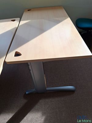 two desks in the corner of a room