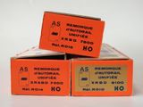 three boxes of cigarettes sitting on top of each other on a white surface