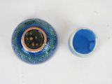 a blue cup and a blue bowl sitting on a table