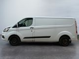 a white van that is parked in a parking lot