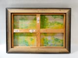une image représentant un tableau accroché au mur, avec un cadre en bois