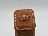 a close up of a wooden box with a ring on it