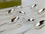 a lot of spoons that are sitting on a table