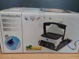 boxed box of a vacuum cleaner sitting on a wooden table