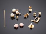 a group of earrings and a necklace on a black surface