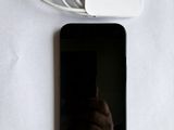 a cell phone with a charger attached to it